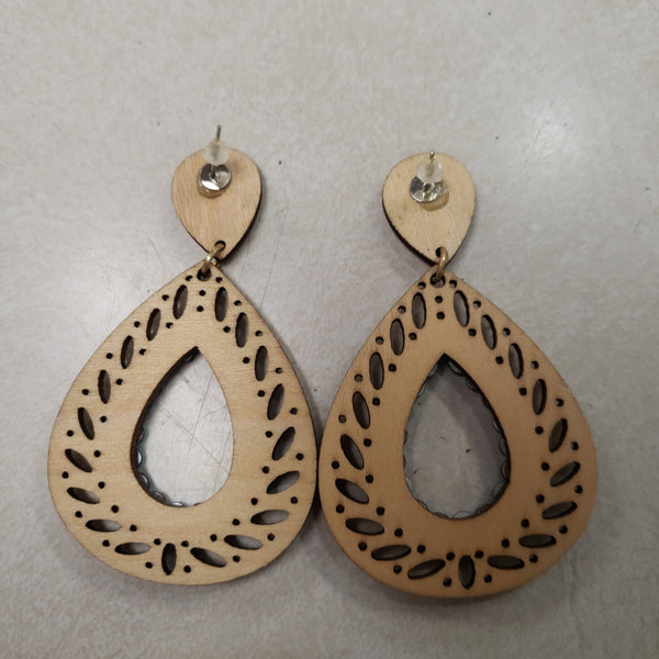 Ivory wood teardrop with blue stone earring