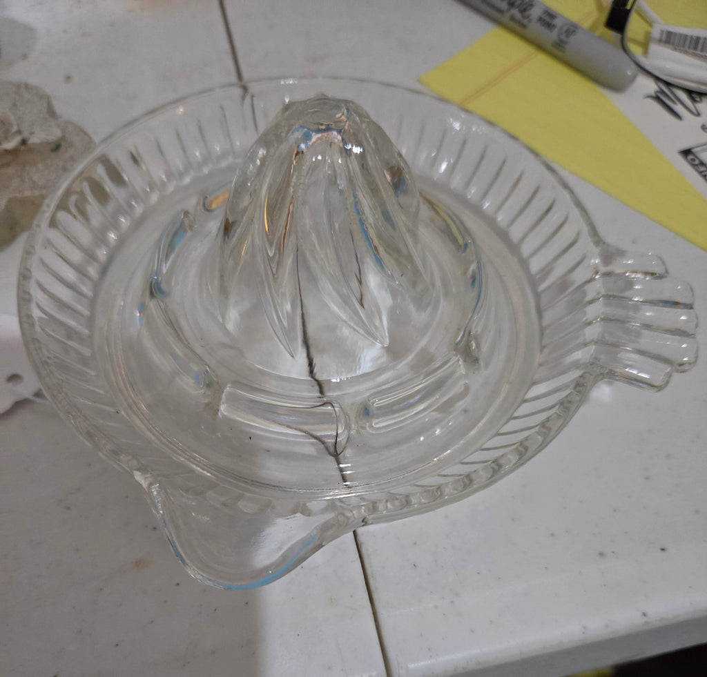 Vintage clear glass orange juicer with handle and spout
