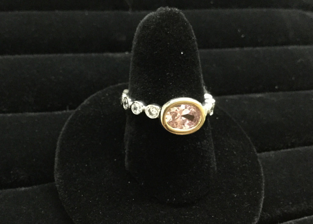Pink ice oval stone with silver and clear rhinestones all the way around