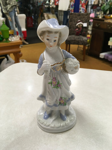 Porcelain girl with grapes figurine