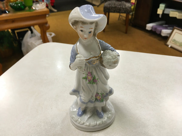 Porcelain girl with grapes figurine