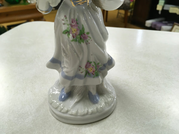 Porcelain girl with grapes figurine